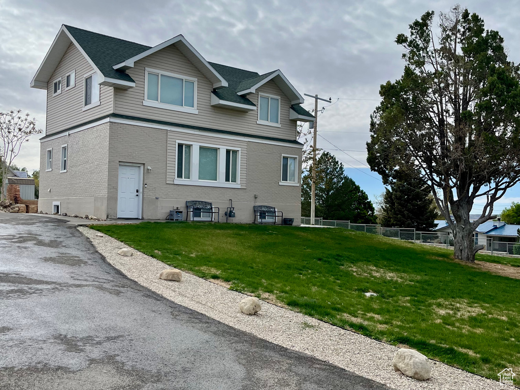 View of front of property with brick siding