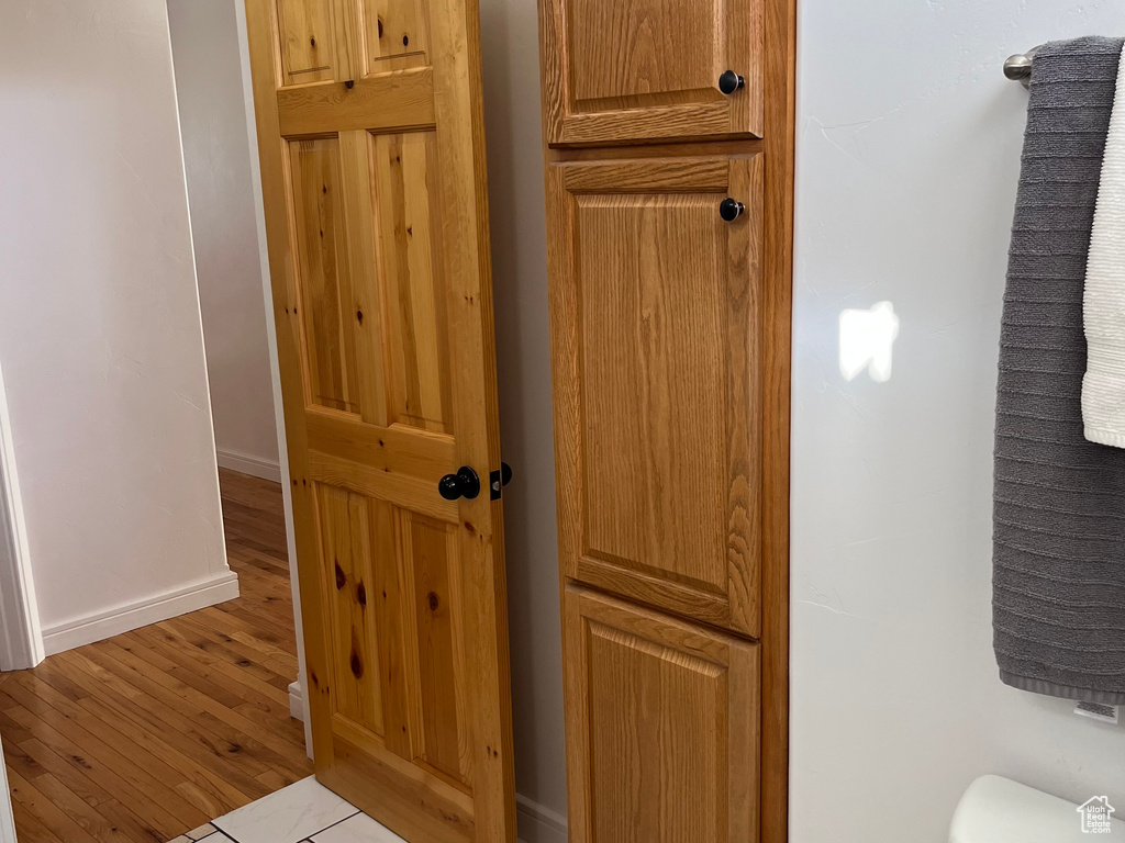 Detailed view of baseboards and wood finished floors