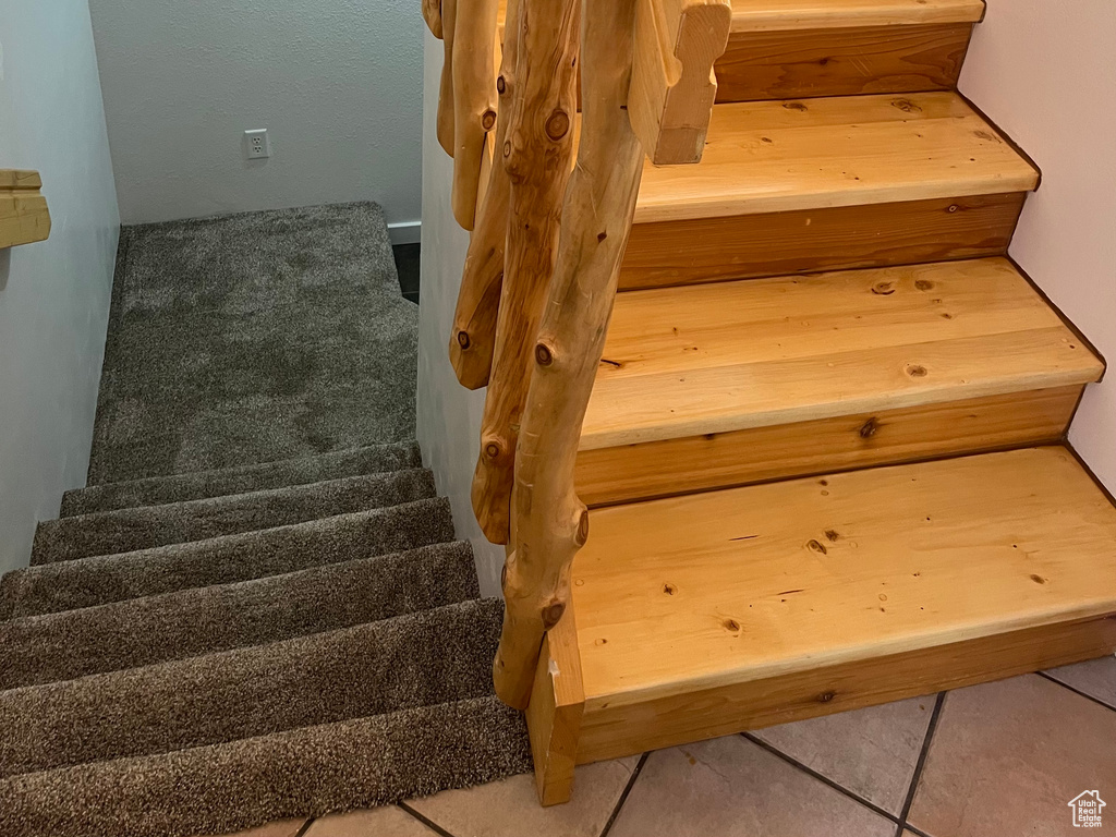Staircase featuring tile patterned flooring