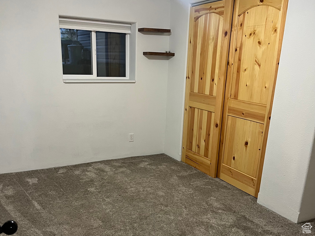 Unfurnished bedroom with carpet flooring