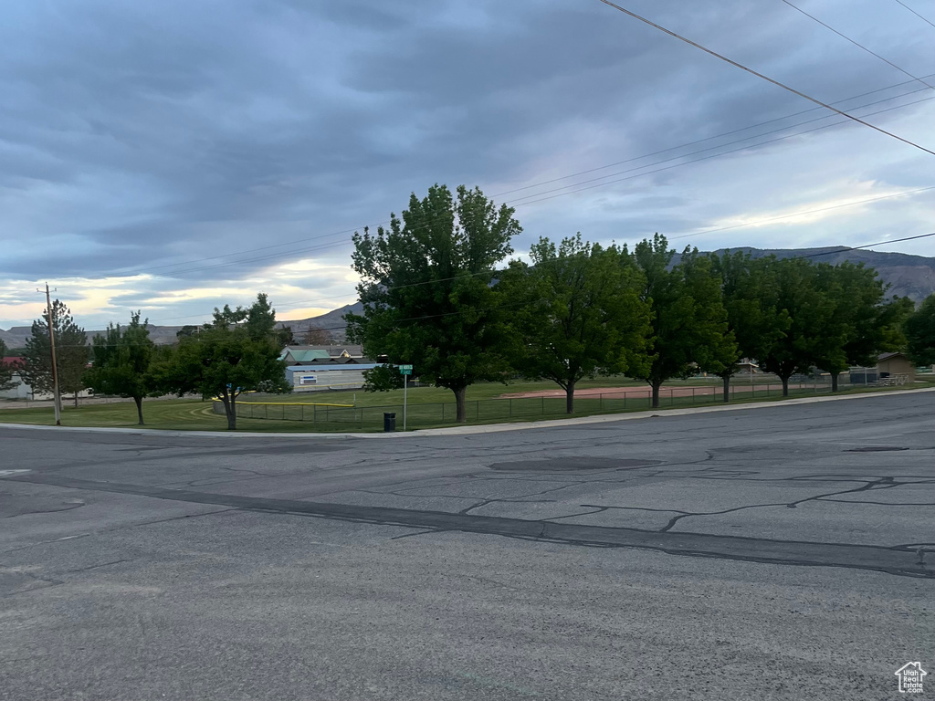 View of asphalt street featuring a mountain view