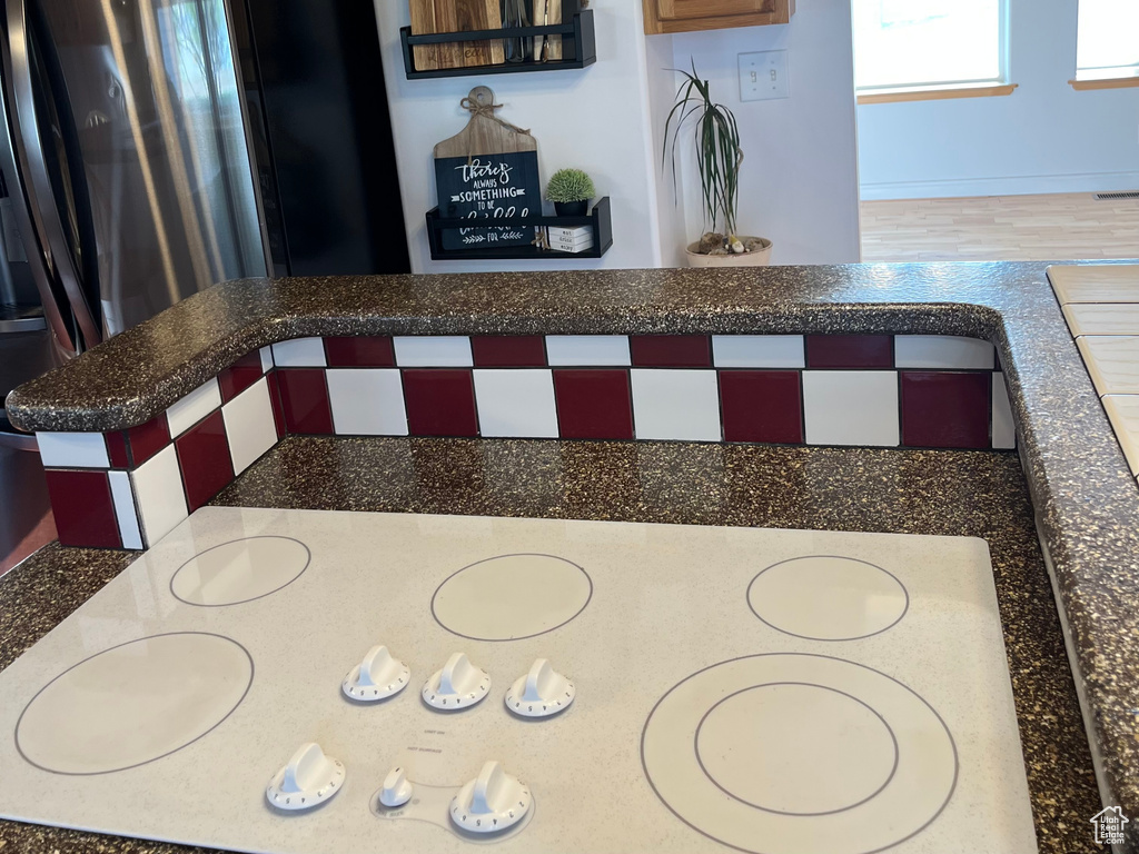 Dining area view of white electric stovetop