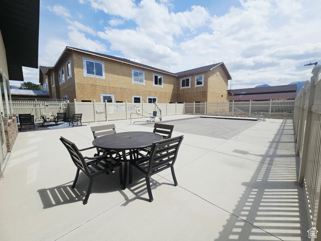 View of patio / terrace featuring fence