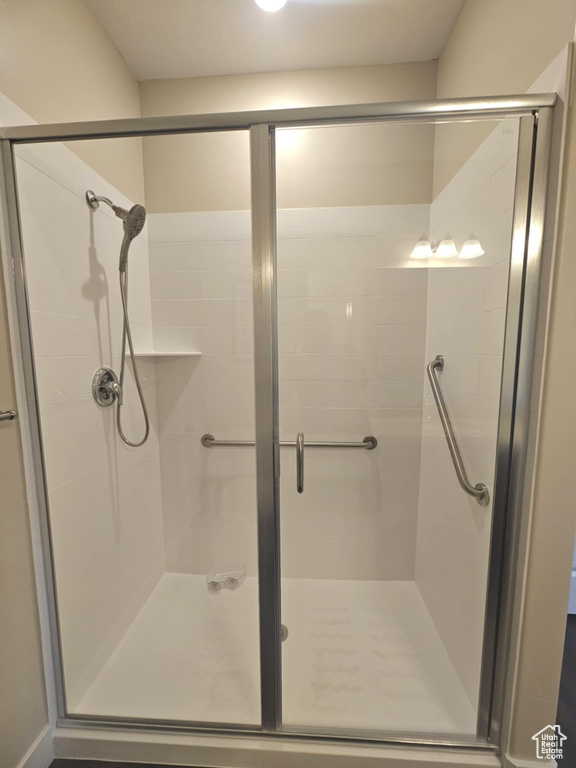 Bathroom featuring a shower stall