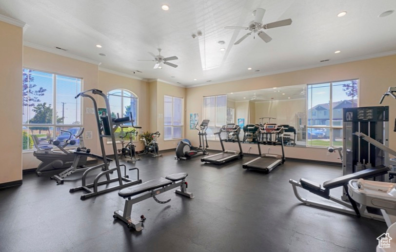 Exercise room with ceiling fan, healthy amount of natural light, crown molding, and recessed lighting