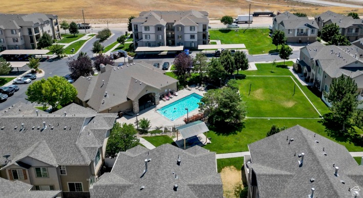 Aerial perspective of suburban area featuring a pool area