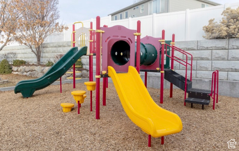 Communal playground featuring fence