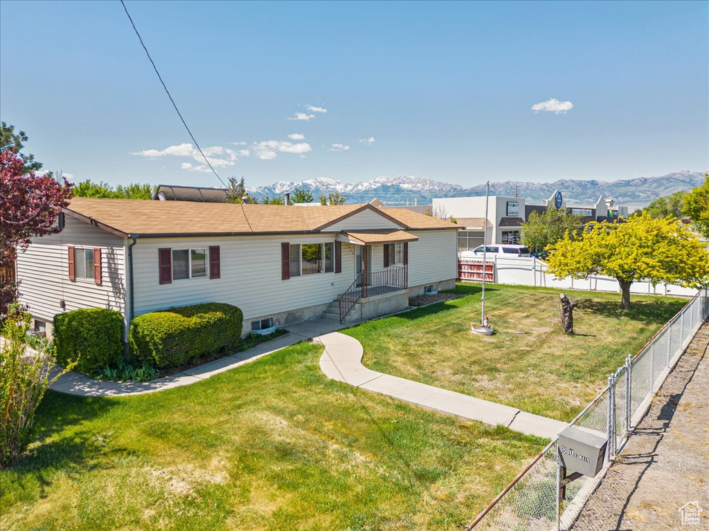 View of front of home featuring a mountain view