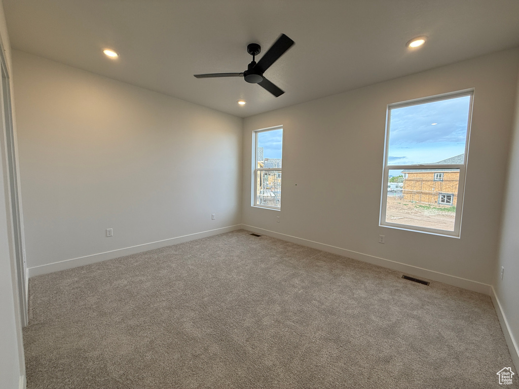 Unfurnished room with carpet, recessed lighting, baseboards, and ceiling fan