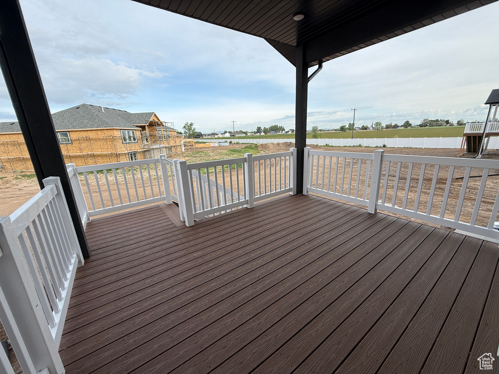 Wooden terrace featuring a water view