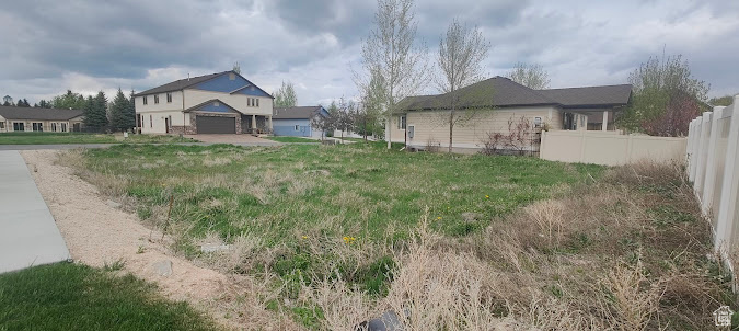 View of yard featuring fence