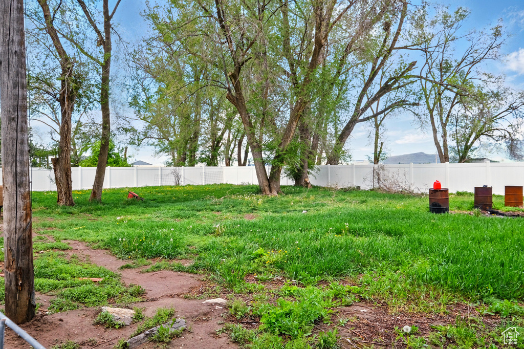 View of yard featuring fence