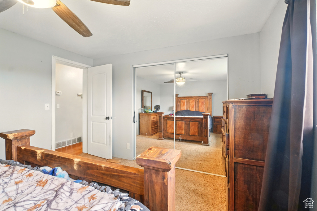 Bedroom featuring carpet floors, a closet, and a ceiling fan