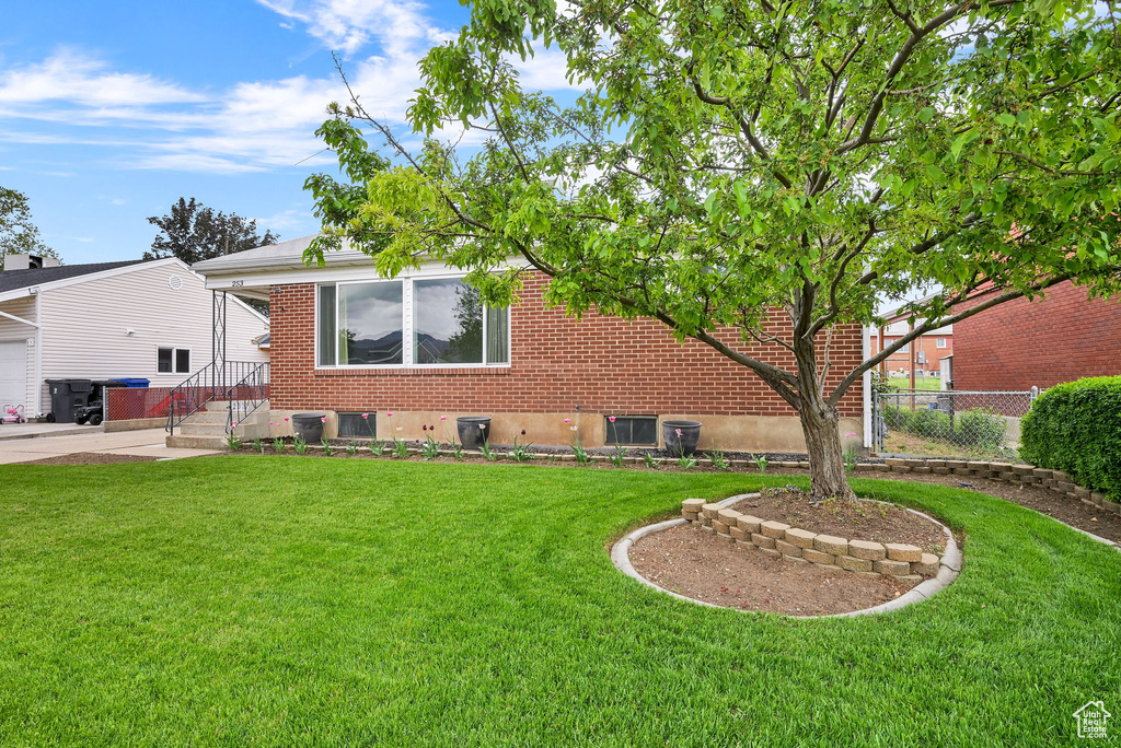 Rear view of house with brick siding