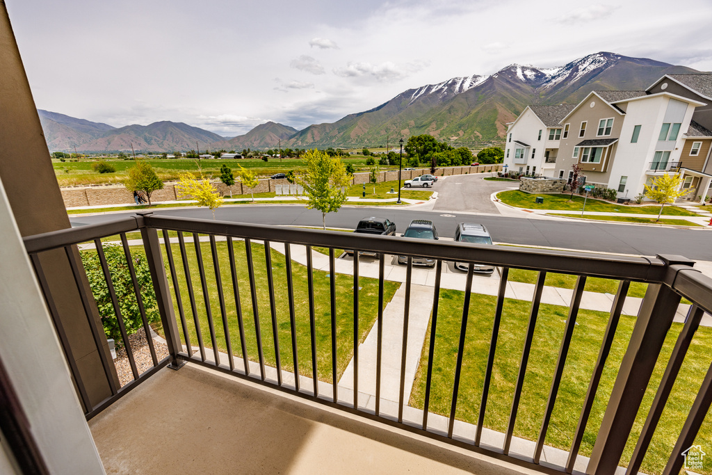 Balcony featuring a mountain view and a residential view