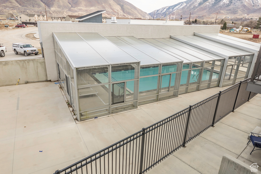 View of pool with a mountain view