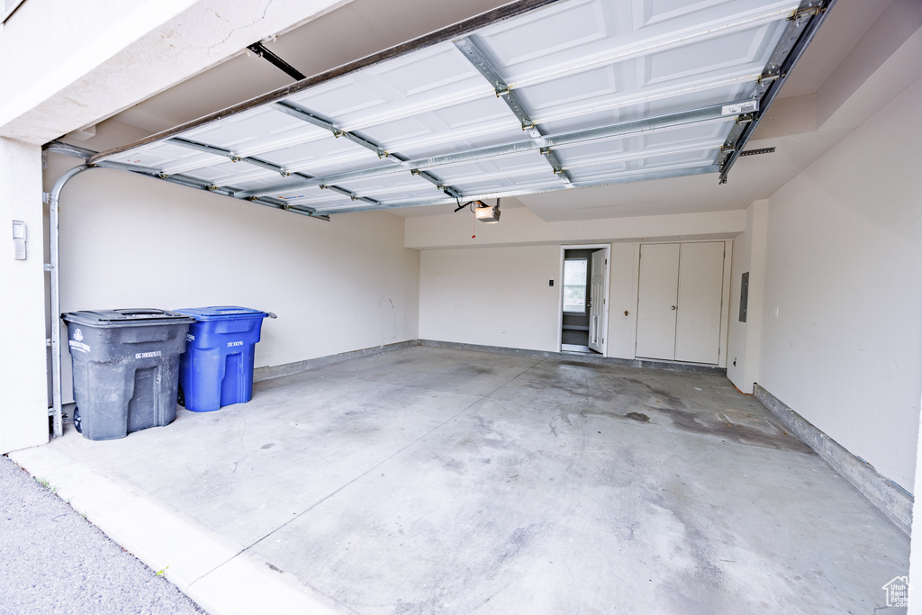 Garage featuring a garage door opener