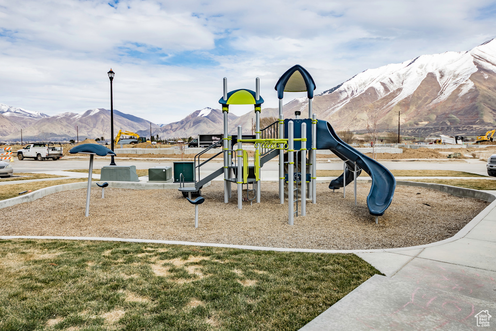Community playground featuring a mountain view