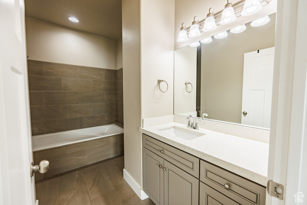 Bathroom featuring vanity and recessed lighting