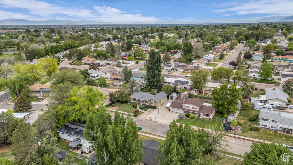Aerial perspective of suburban area featuring a mountain backdrop