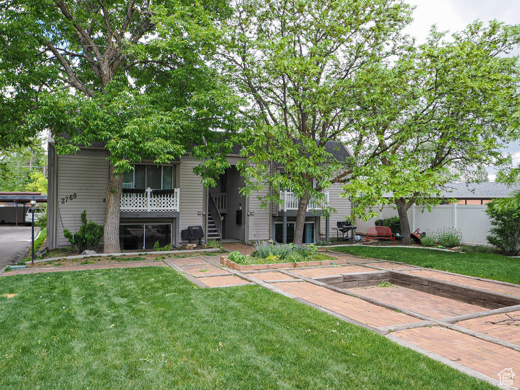 Rear view of property featuring stairs