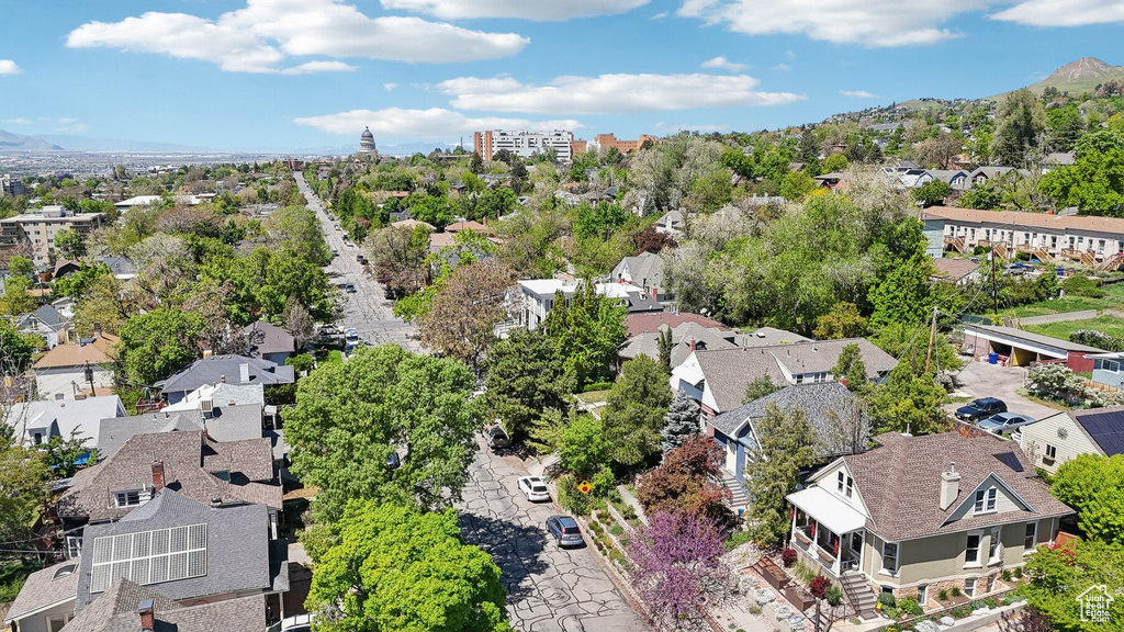 Aerial perspective of suburban area featuring a mountainous background