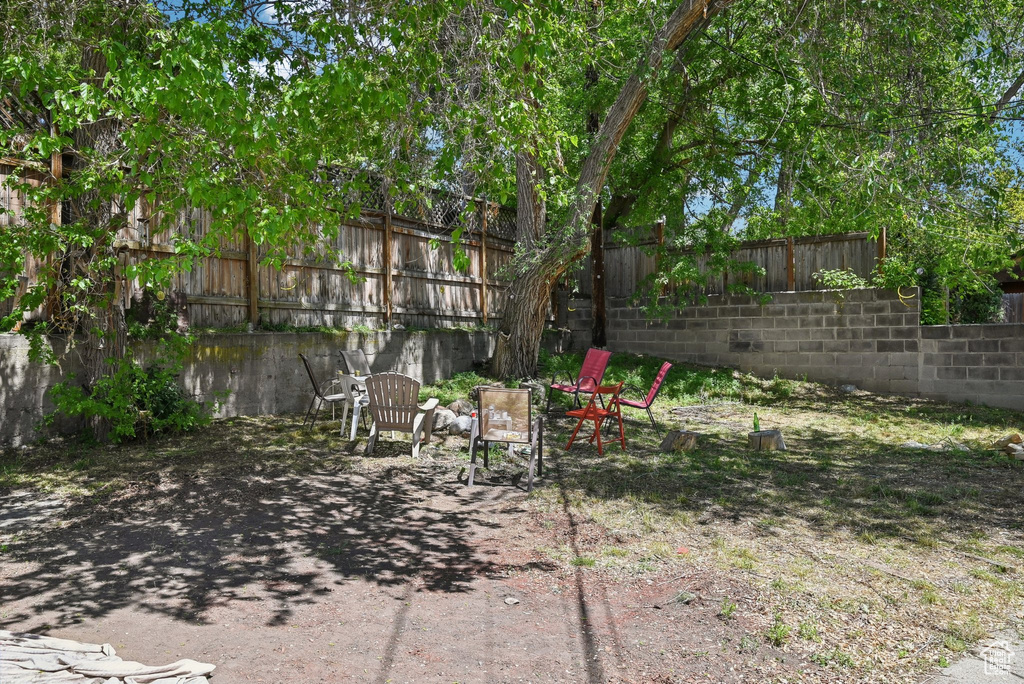 Fenced backyard with a patio