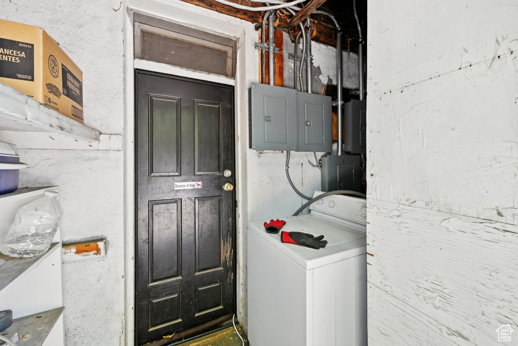 Laundry area featuring washer / clothes dryer and electric panel