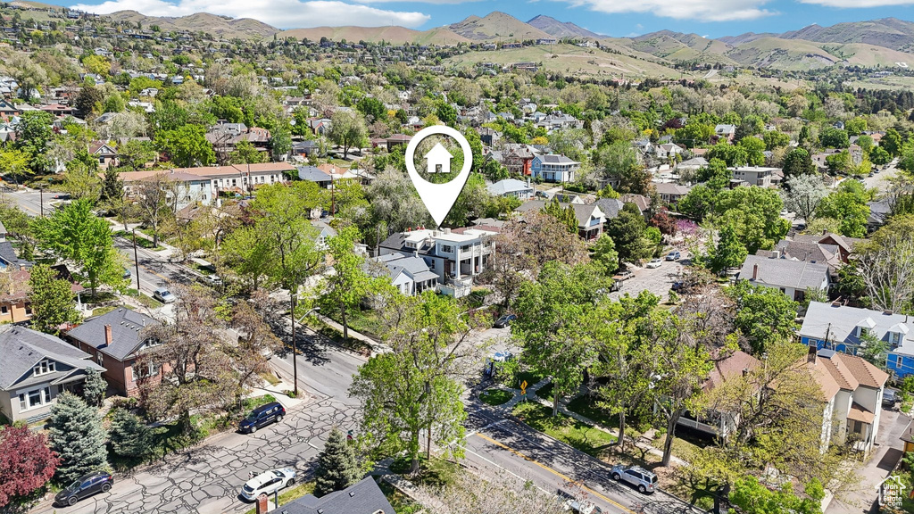 Aerial view of residential area featuring mountains