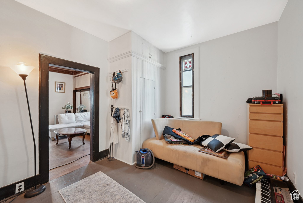 Living area featuring baseboards and wood finished floors