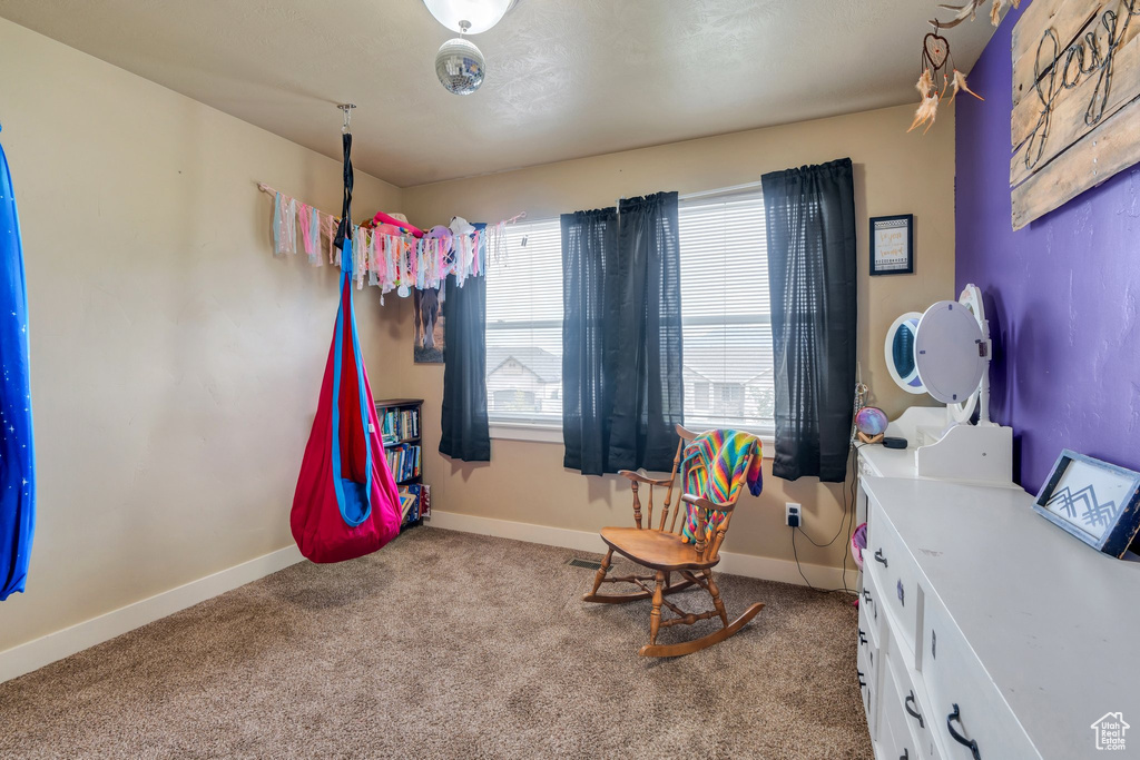 Bedroom with carpet floors and baseboards