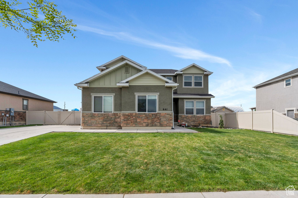 Craftsman-style house with stone siding and stucco siding