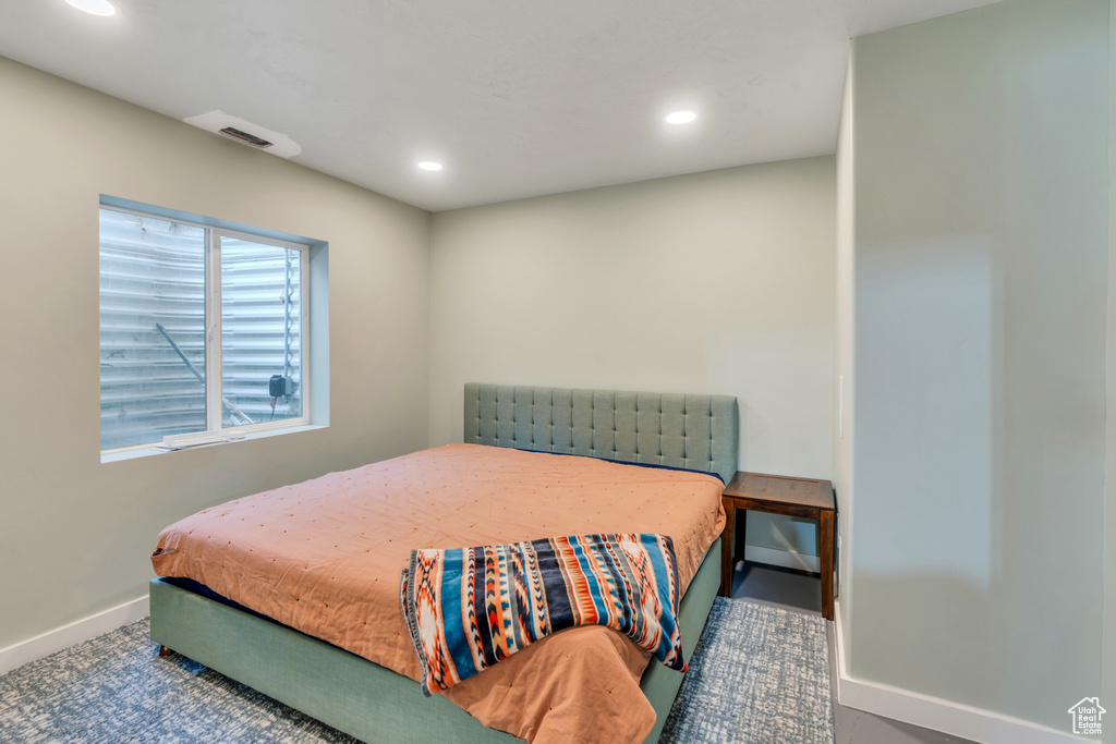 Bedroom featuring recessed lighting and baseboards