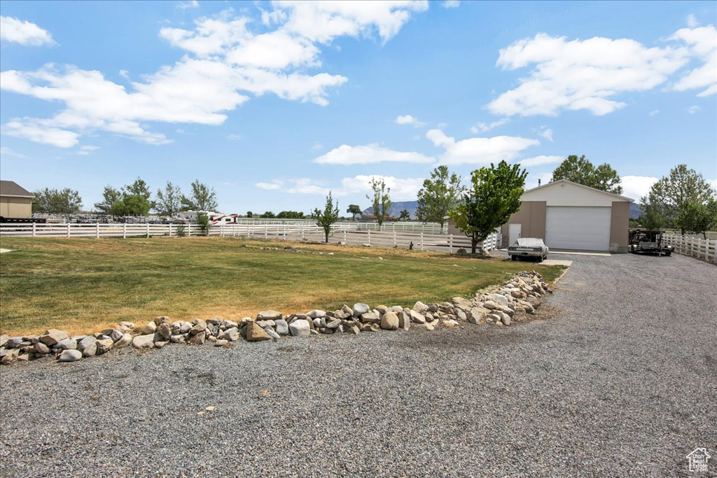 View of yard with an outbuilding and a detached garage