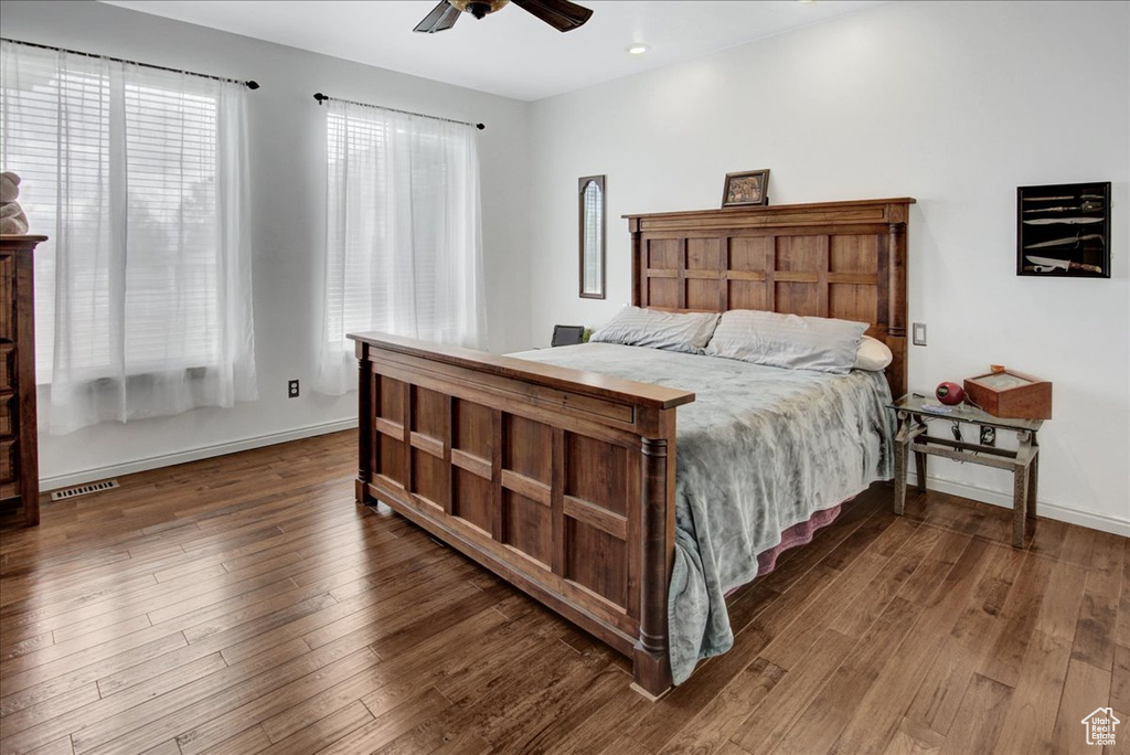 Bedroom featuring wood finished floors, baseboards, a ceiling fan, and recessed lighting