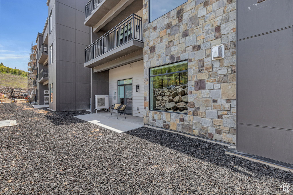 Back of property featuring a balcony