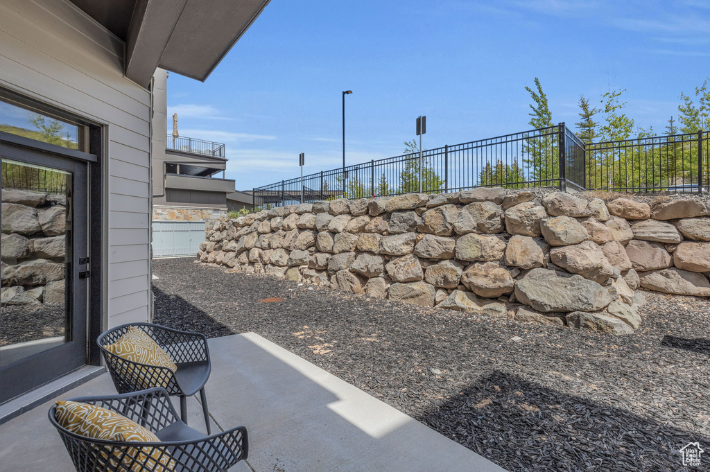 View of yard featuring fence