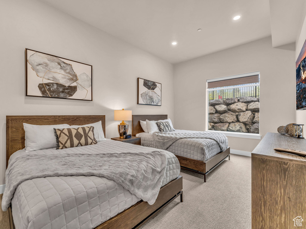 Carpeted bedroom featuring recessed lighting and baseboards