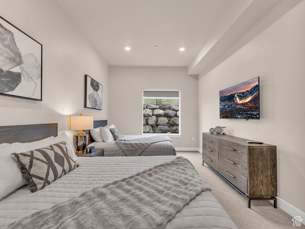 Bedroom with baseboards, light colored carpet, and recessed lighting