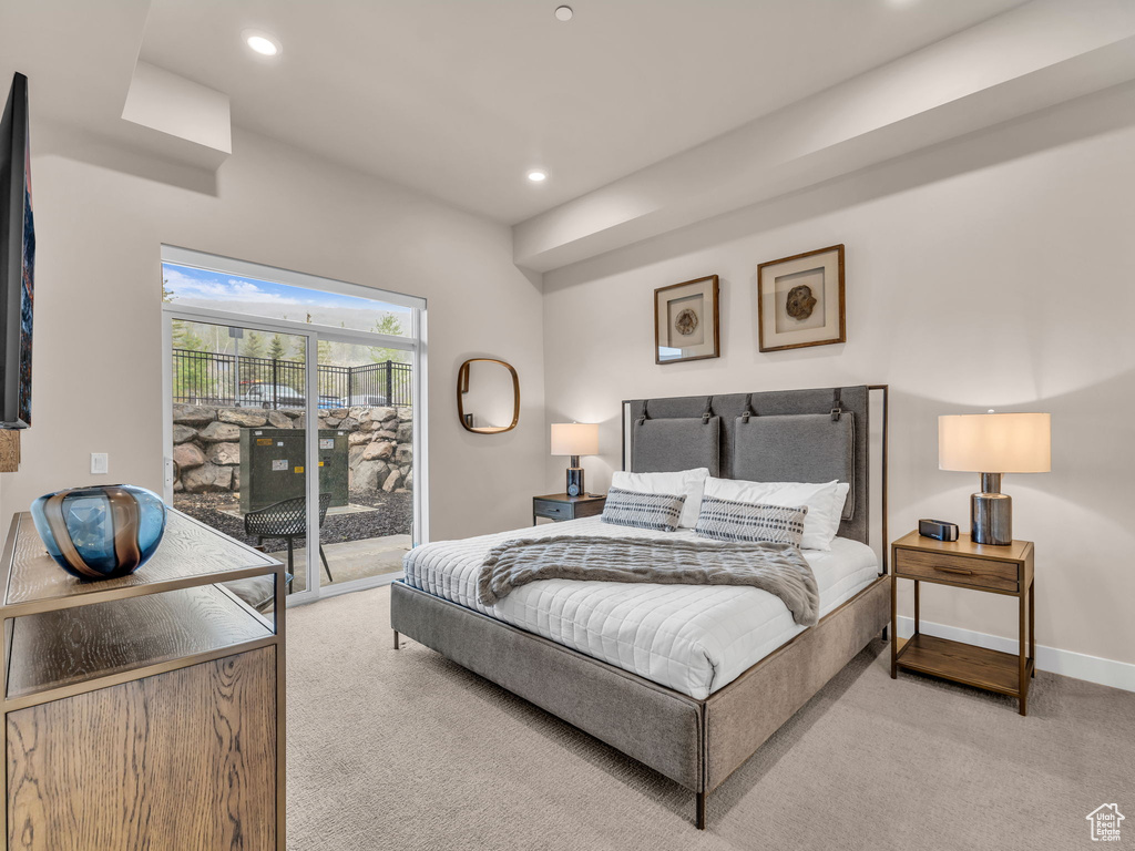Bedroom with carpet flooring, access to outside, recessed lighting, and baseboards