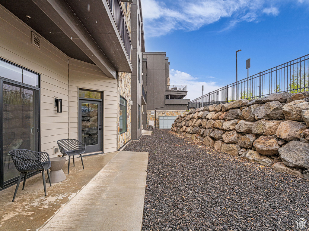 View of yard with a patio area and fence
