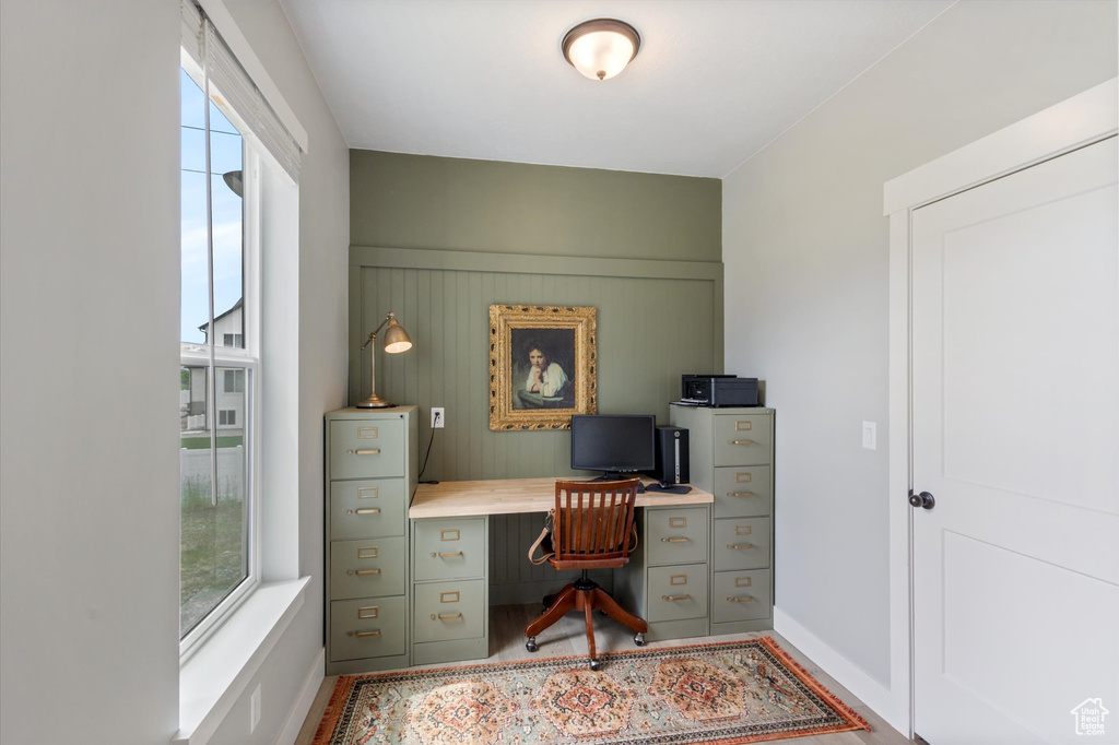 Office area featuring baseboards and wood finished floors