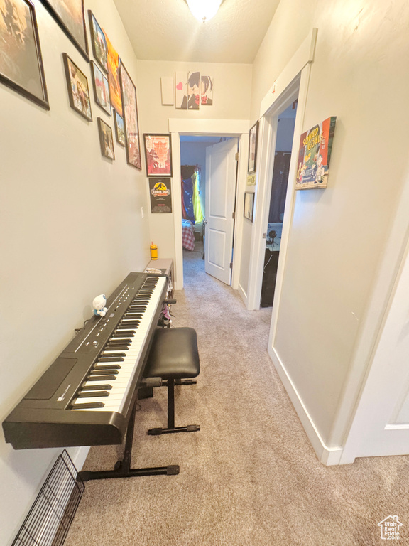 Hall featuring carpet floors