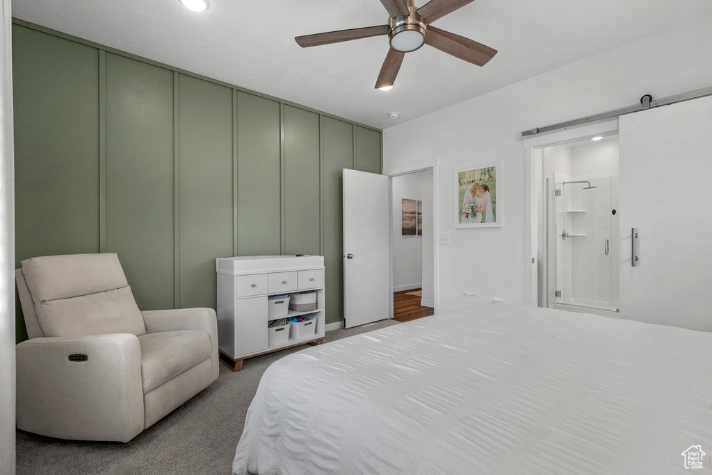 Carpeted bedroom with recessed lighting, a ceiling fan, and ensuite bath