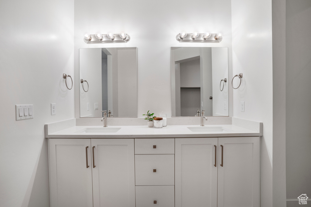 Bathroom featuring double vanity