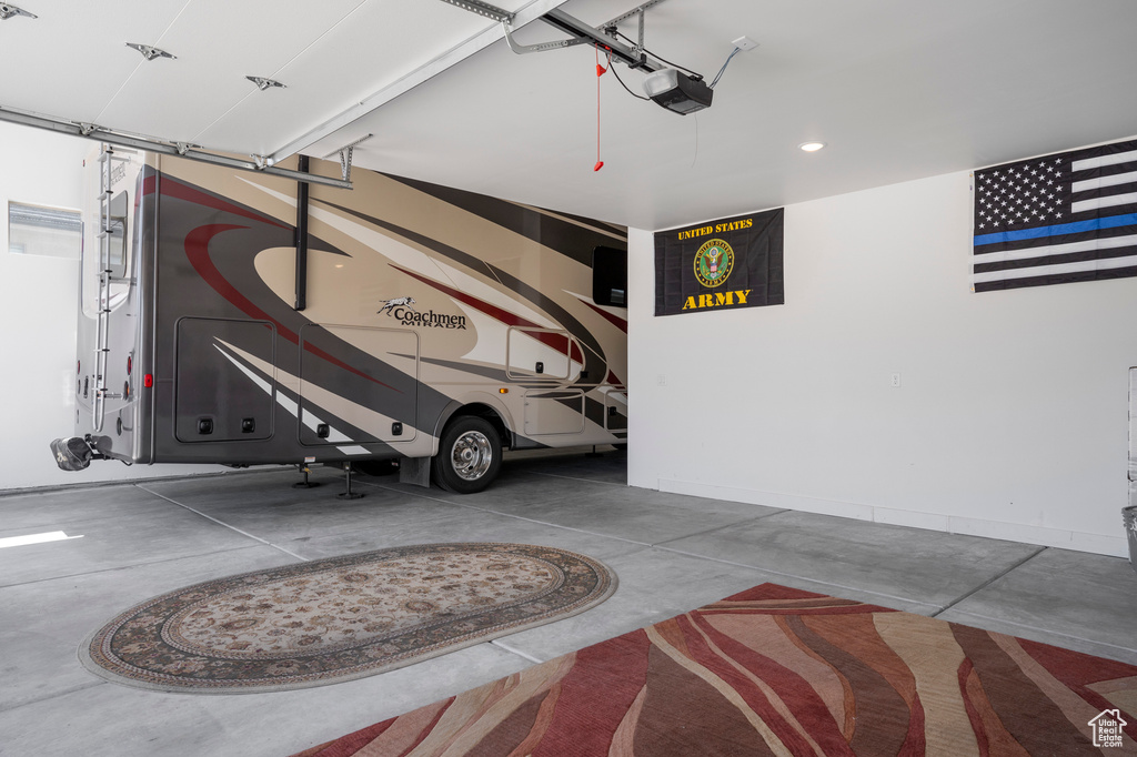 Garage with a garage door opener and recessed lighting
