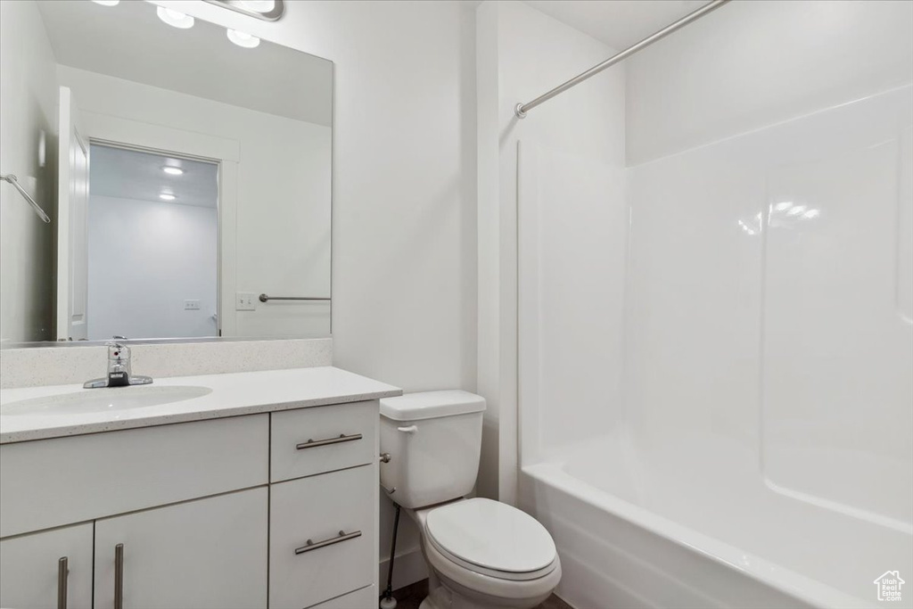 Full bathroom with vanity, toilet, and bathing tub / shower combination