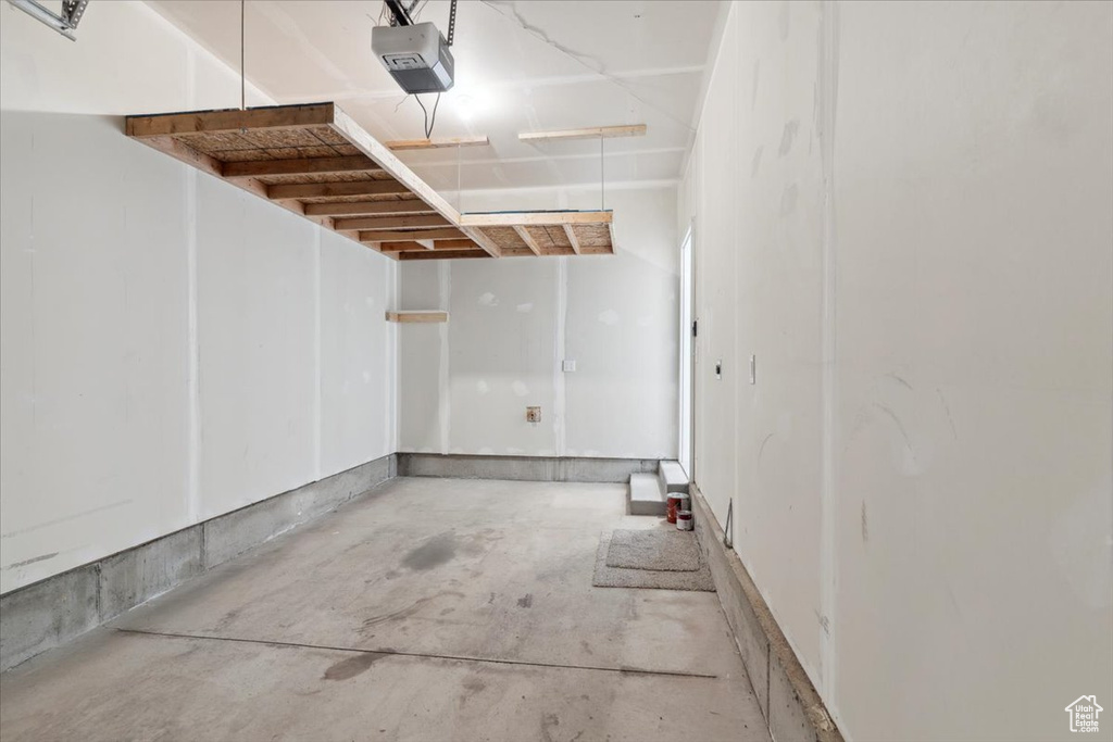 Garage featuring a garage door opener