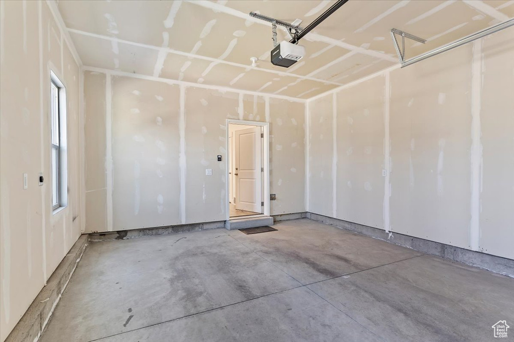 Garage featuring a garage door opener