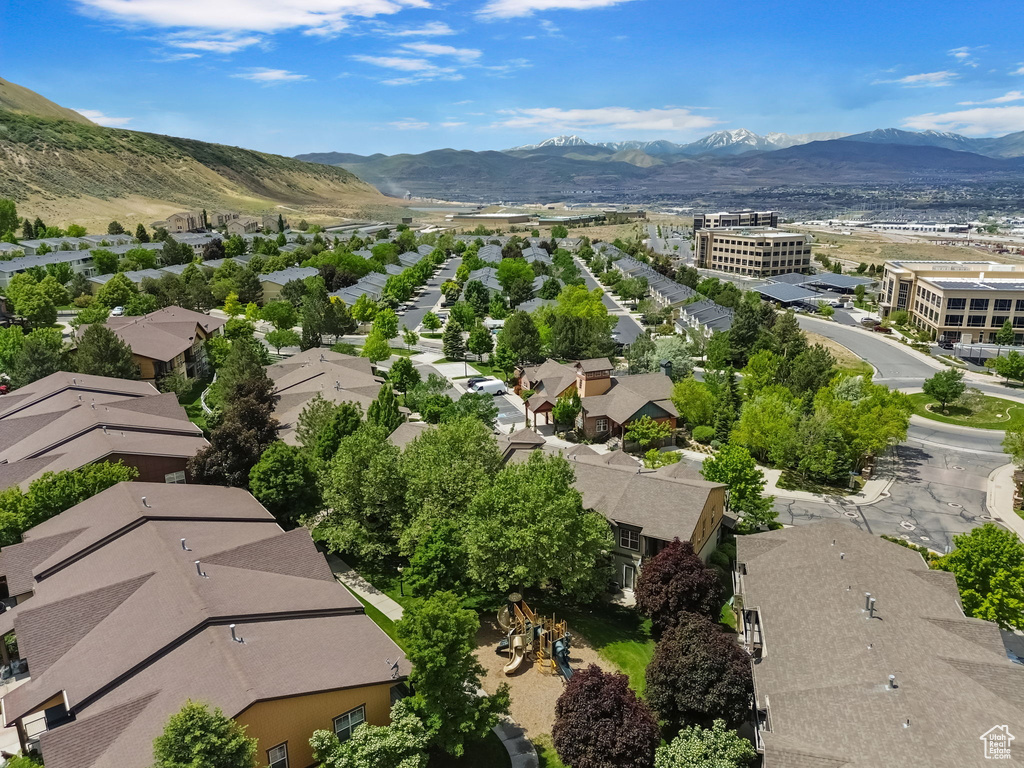Aerial perspective of suburban area featuring a mountain backdrop